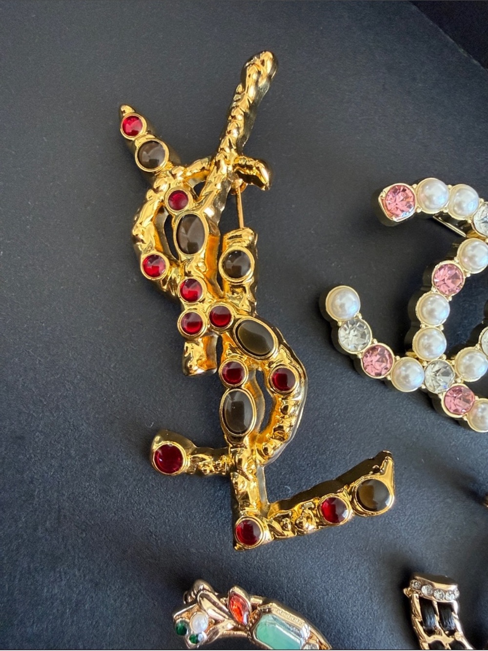 Gold-Tone Decorative Brooch with Red and Smoky Stones